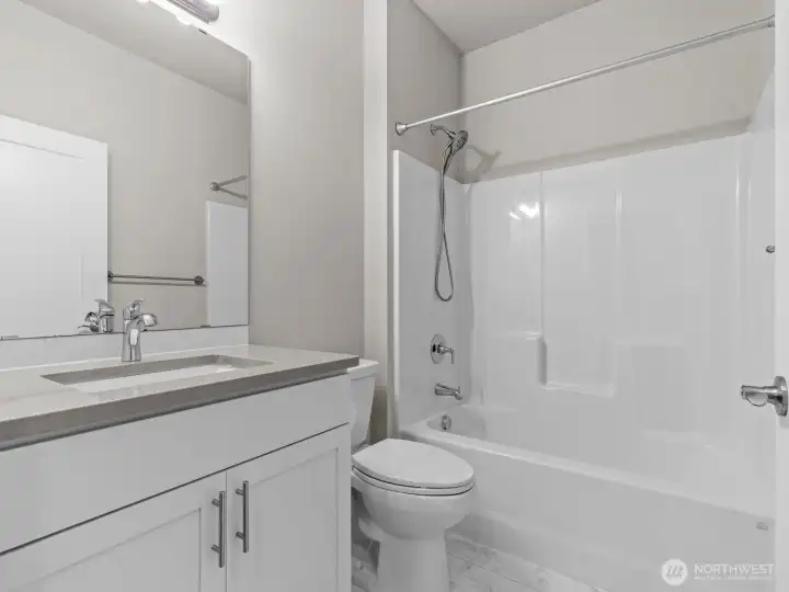 Just down the hall after you pass the coat closet is the conveniently located guest bathroom.