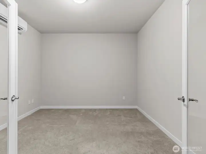 Nearby is the private home office with French doors.