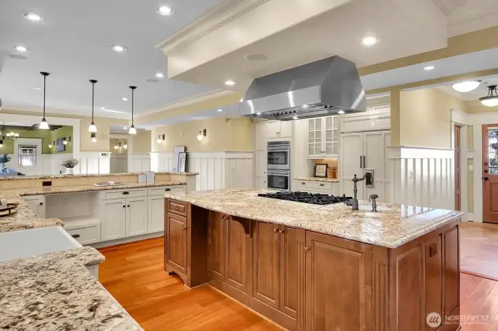Dual Wolf wall ovens and a Sub-Zero fridge/freezer complete the appliance package in the kitchen