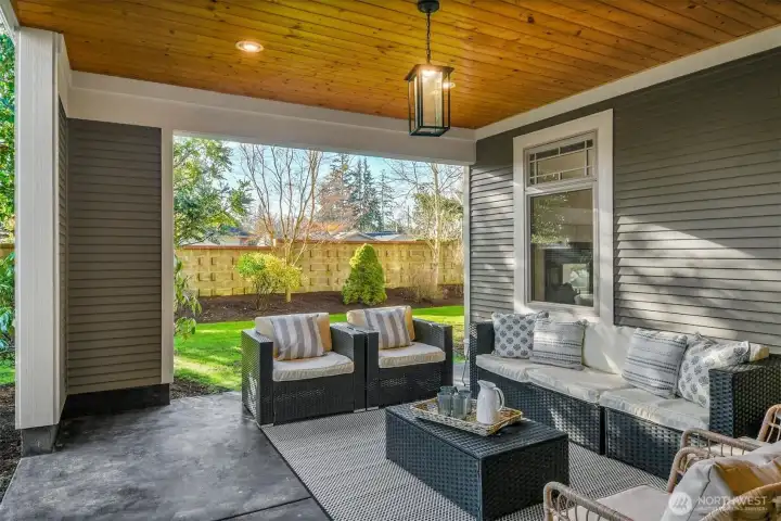 This covered patio area is accessed from both the kitchen and the family room