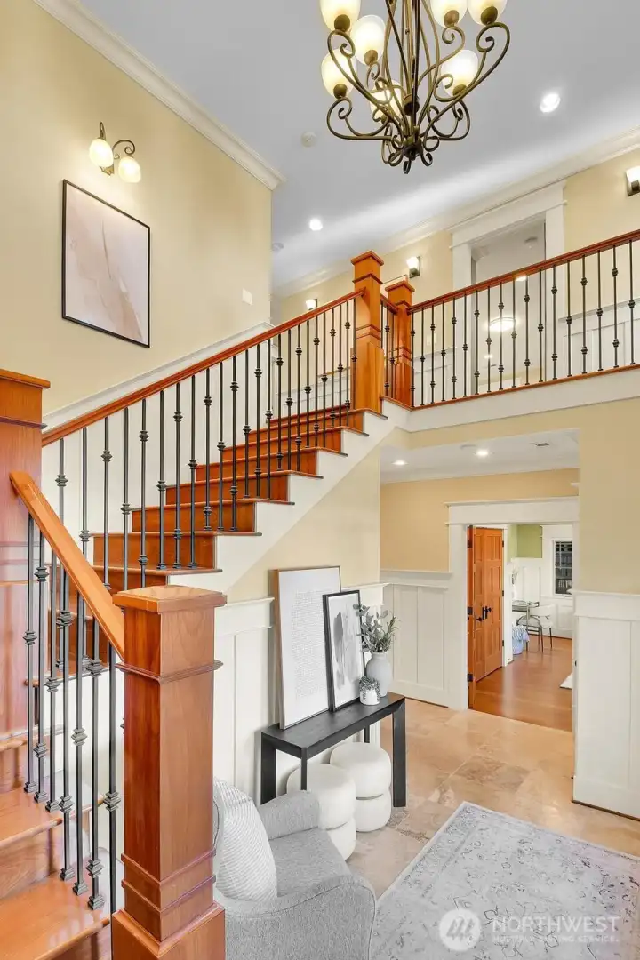 Stunning staircase to upper level in formal entry foyer