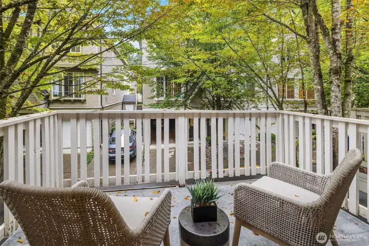Private balcony overlooking mature trees.