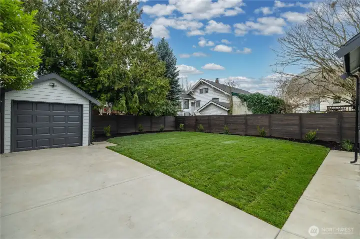 Detached garage with plenty of driveway parking