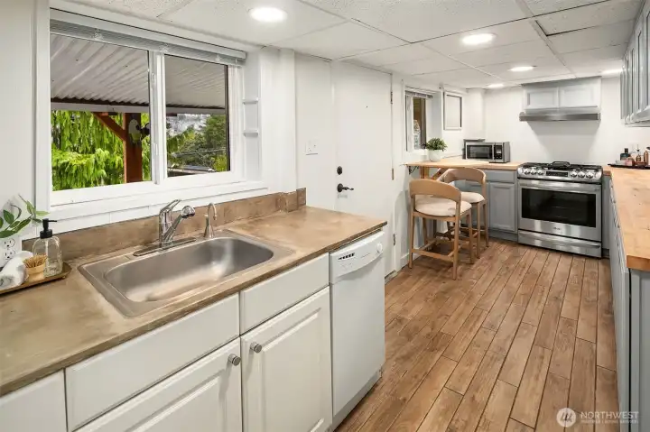 Kitchenette on Lower Level off rec room. Note its own door to outside to the patio under the deck.