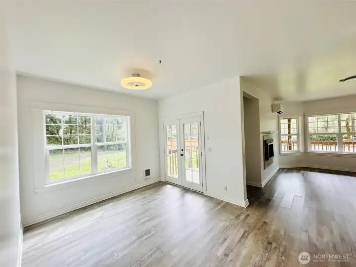 Dining Room with doors leading out onto large wrap around deck