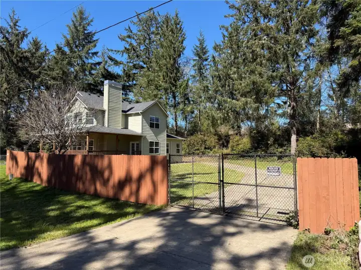 2nd driveway gated RV parking at back of house