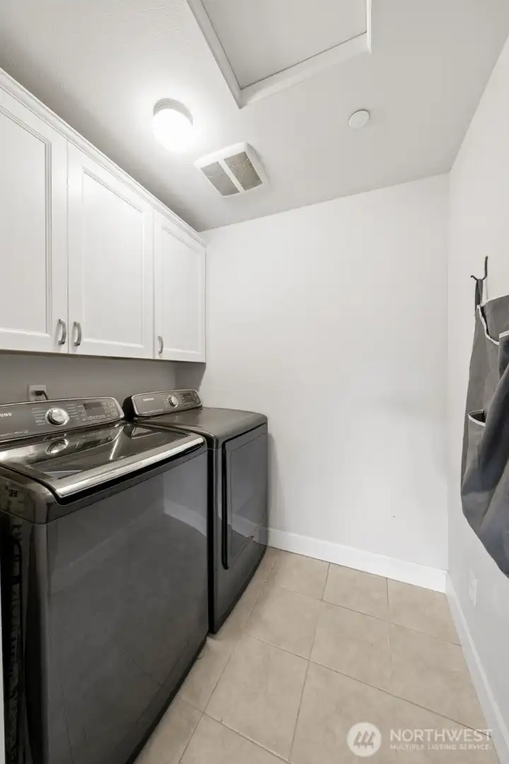 Laundry room with cabinets