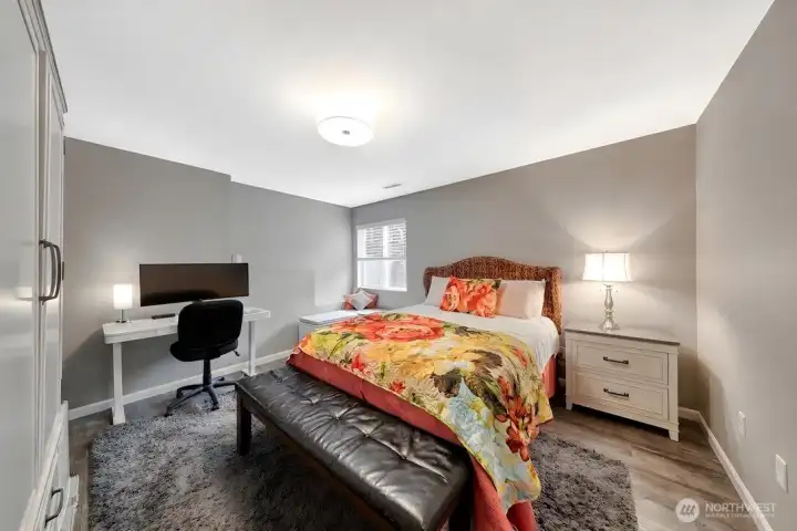 Lower-level 4th bedroom ideal for guests, multi-generational living, or income potential.