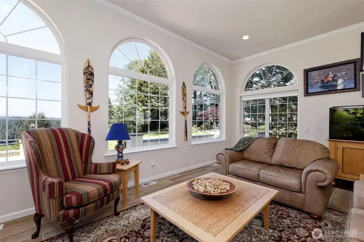 Another shot of the living room, with beautiful porcelain tile flooring, and those beautiful windows.