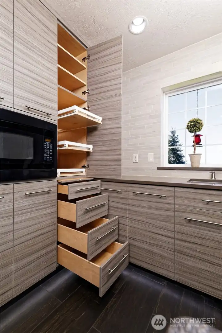 These cupboards are the best! They are soft-close, with pullouts that allow you to get to the very back.  You'll never lose that particular spice jar again!