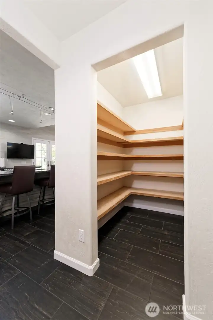 Jumbo walk-in pantry just off of the kitchen.
