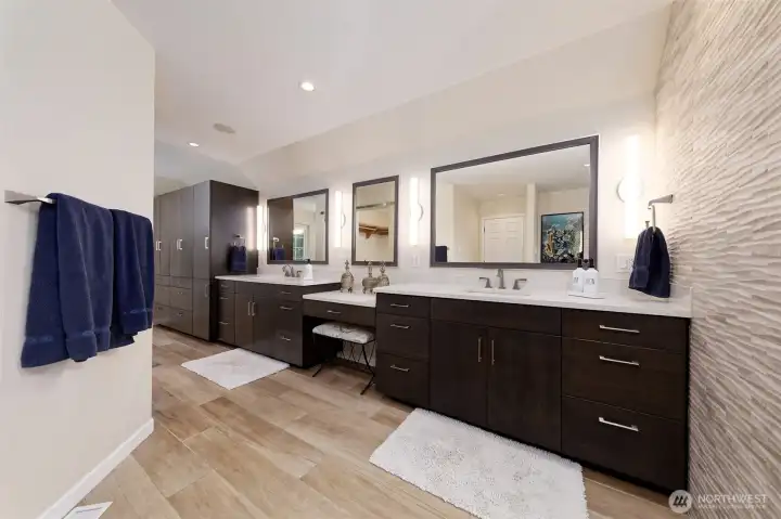 This is the Primary bathroom - Italian porcelain HEATED flooring, Quartz countertops, even a laundry chute that drops your laundry right into the utility room. So cool!