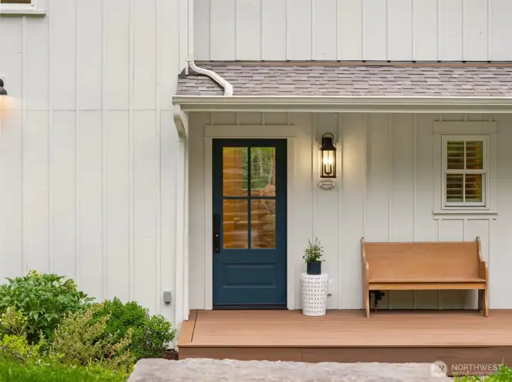 A welcoming front porch with deep roof overhang.