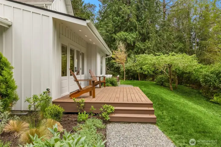A west-facing deck adjoins the great room. Note fruit trees on right side of photo.