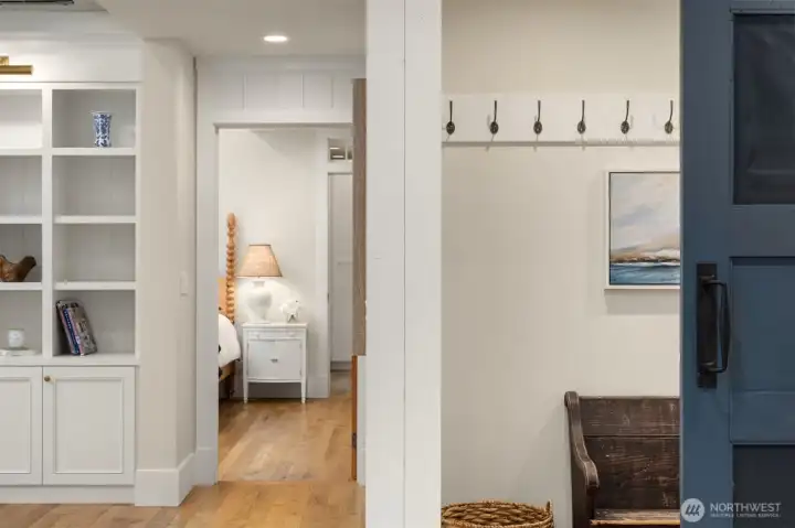 Adjacent to the front door is a wonderful nook with barn door, the perfect place to tuck away shoes, coats and bags.