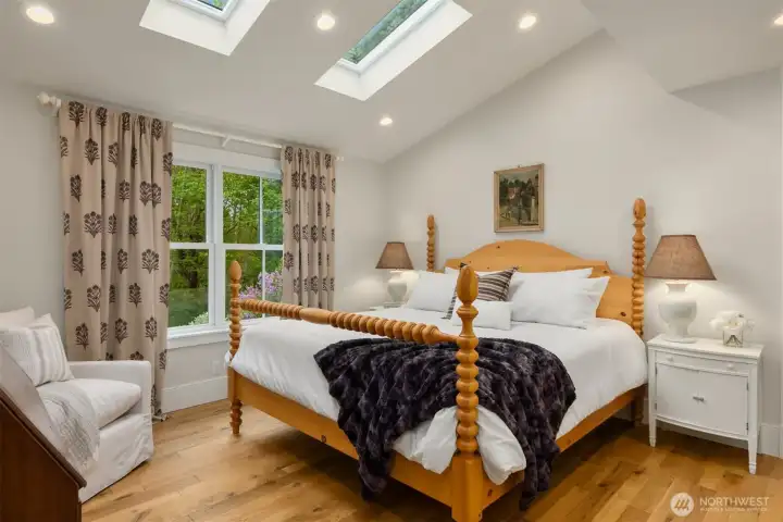The main floor primary bedroom is timeless and elegant.