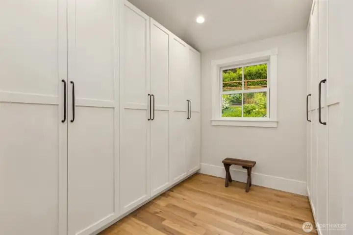A generous primary closet has custom built-ins to keep the closet tidy.