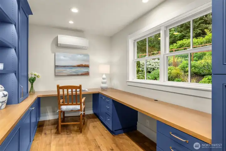 Dreamy home office! Located on the main floor of the home with windows facing gardens and elegant custom cabinetry.