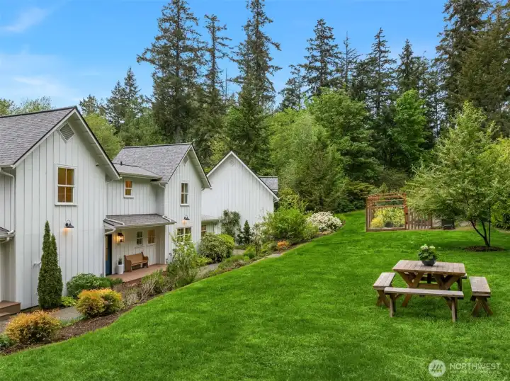 The eastern portion of the yard is level - plenty of space for croquet or bocce!