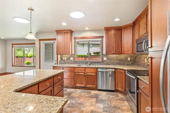 The large white ceiling rounds are actually tubular skylights that add plenty of natural lighting. The large white ceiling rounds are actually tubular skylights that add plenty of natural lighting.