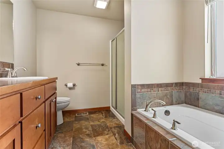 Primary bath with dual sinks, soaking tub and walk in shower, gourgeos stone surround. Primary bath with dual sinks, soaking tub and walk in shower, gourgeos stone surround.