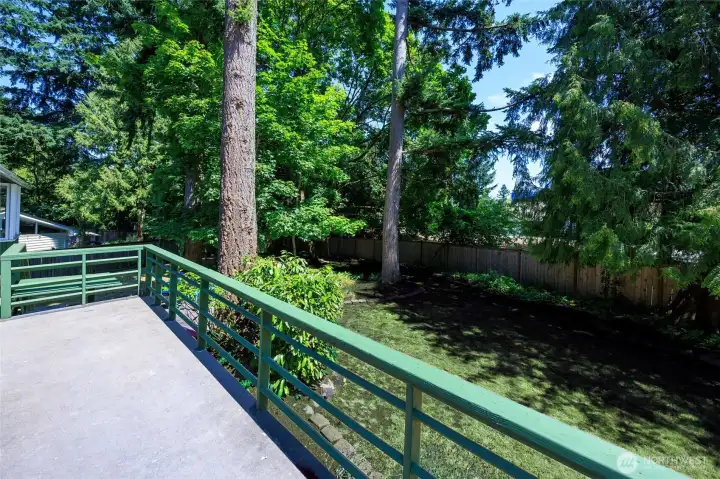 Peaceful deck and yard.