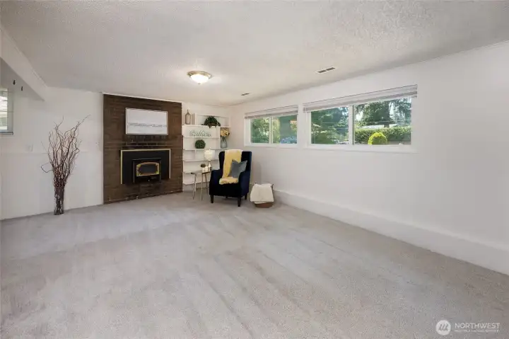 Lower level recreation room and adjacent bedroom/home office.