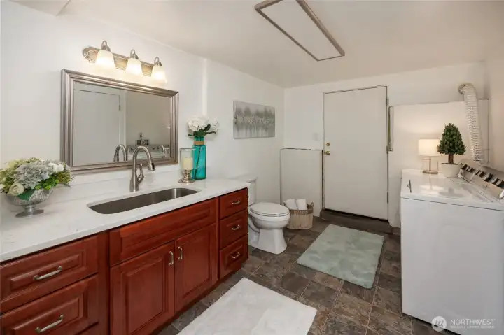 Lower level bathroom and laundry room.
