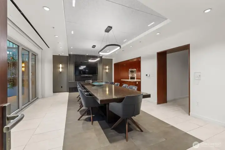Conference room with adjacent full kitchen. Conference room with adjacent full kitchen.