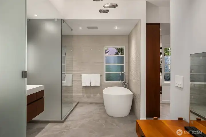 Spacious primary bath, with soaking tub, separate shower, double sinks and laundry(opposite - not pictured). Spacious primary bath, with soaking tub, separate shower, double sinks and laundry(opposite - not pictured).