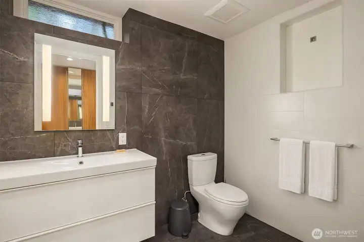 Lower-level en-suite 3/4 bathroom(shower not pictured). Lower-level en-suite 3/4 bathroom(shower not pictured).