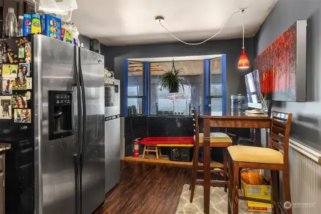 Kitchen with room for informal dining and enclosed sunporch for overflow entertaining!