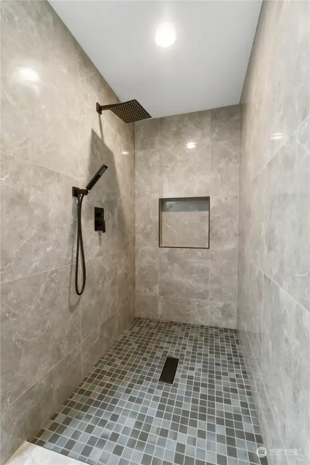 3/4 bathroom with beautiful tiled shower