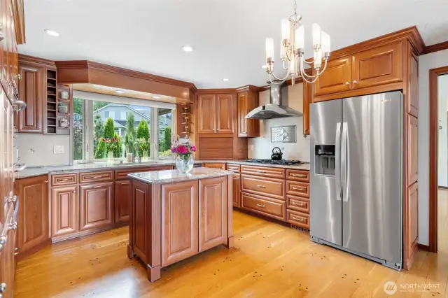 Beautifully designed kitchen with granite countertops and stainless-steel appliances.
