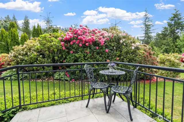 The front entrance features charming patio, perfect for enjoying the garden.