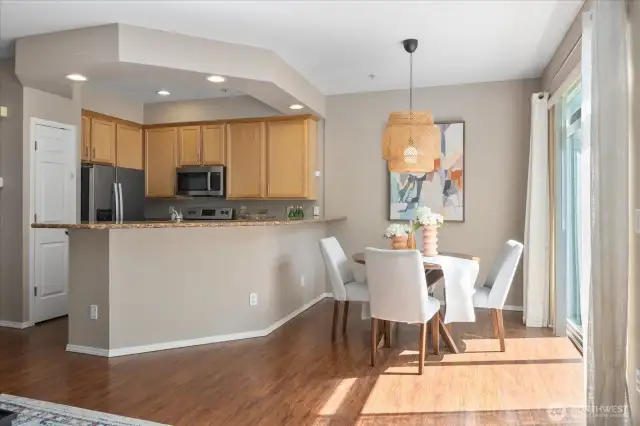 Light & Bright Dining Space leads to upper level deck over looking park setting.