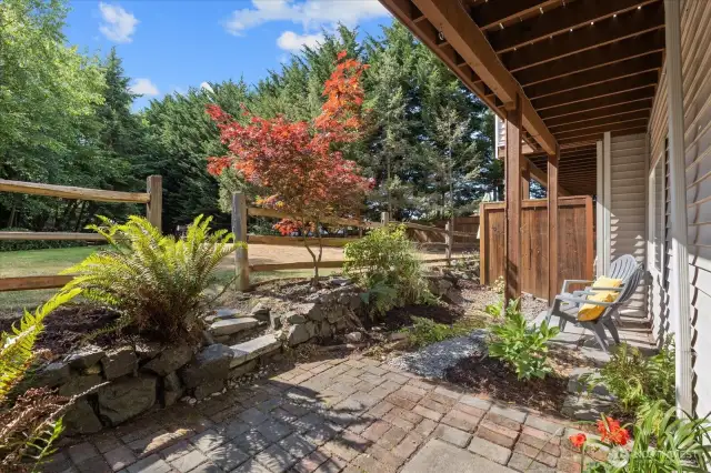 Private Patio from the lower level connects seamlessly to the park. Morning Coffee with the Birds and space for your BBQ & Hammock.