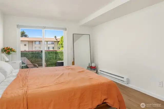 Plentiful space and light in this primary bedroom.