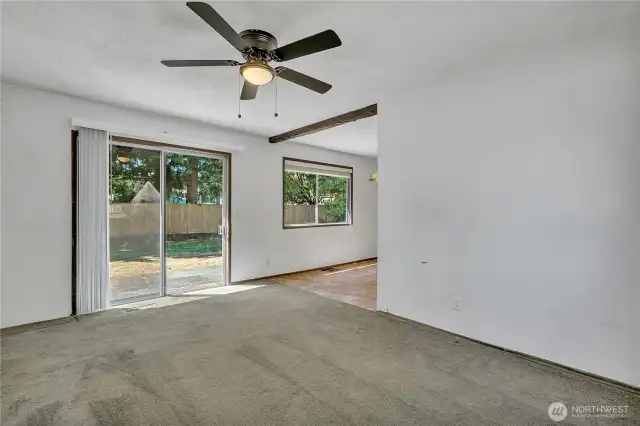 Sliding glass door from the family room leads into the large, level backyard