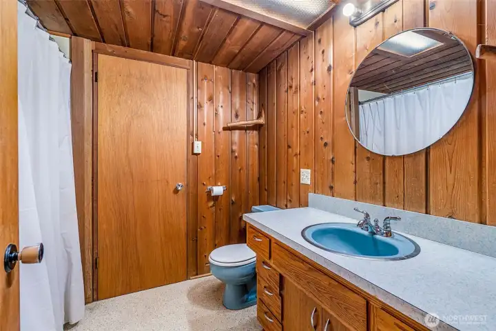 Linking the two upstairs bedrooms, this shared bath has great bones but is ready for a full re-do. Think of it as a blank canvas—waiting for fresh style to match the cedar-lined charm around it.
