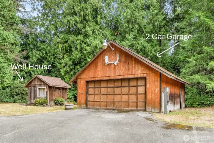 Guarded by grand antlers out front, this detached two-car hideaway is less “empty parking” and more “mystery museum.” Crammed with curiosities you’ll inherit, it’s equal parts garage and adventure.
