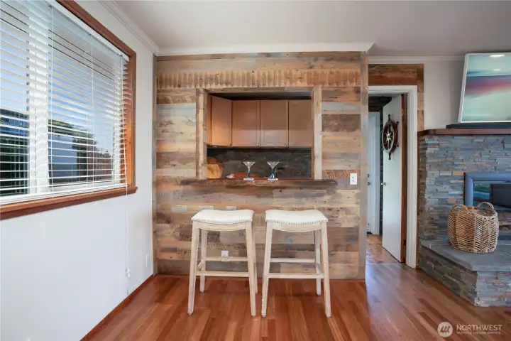 Cool wet bar for entertaining with refrigerators included and lots of storage space.  Door to the deck.