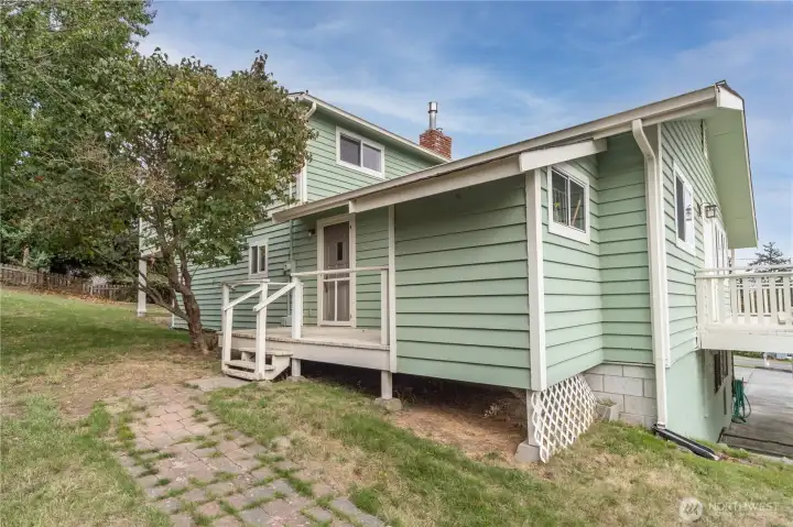 Backdoor next to kitchen/ laundry area.