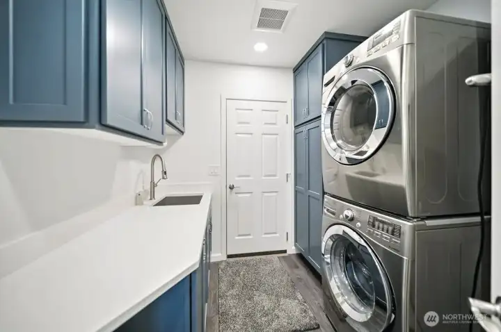 Utility room loaded with storage.