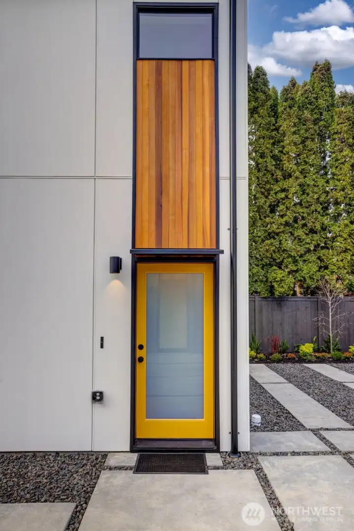 Cedar entryway enhances the clean lines and sleek exterior of this home.