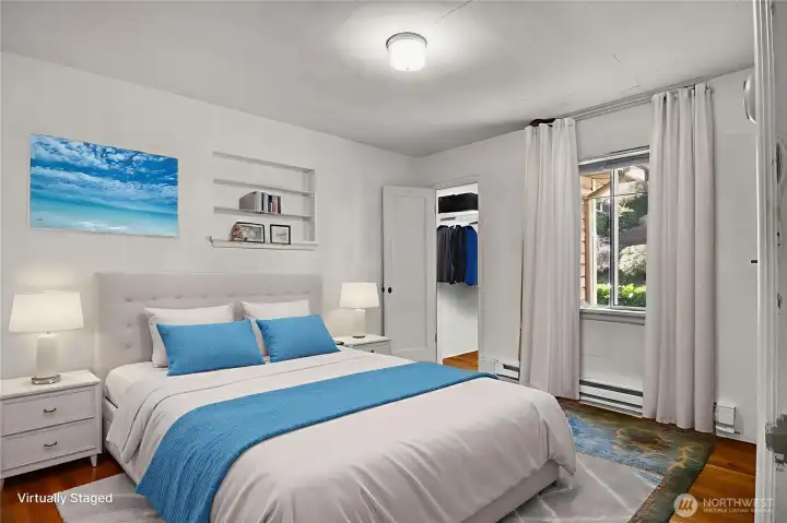 This bedroom has a walk-in closet and more of those beautiful hardwoods! Virtually staged.