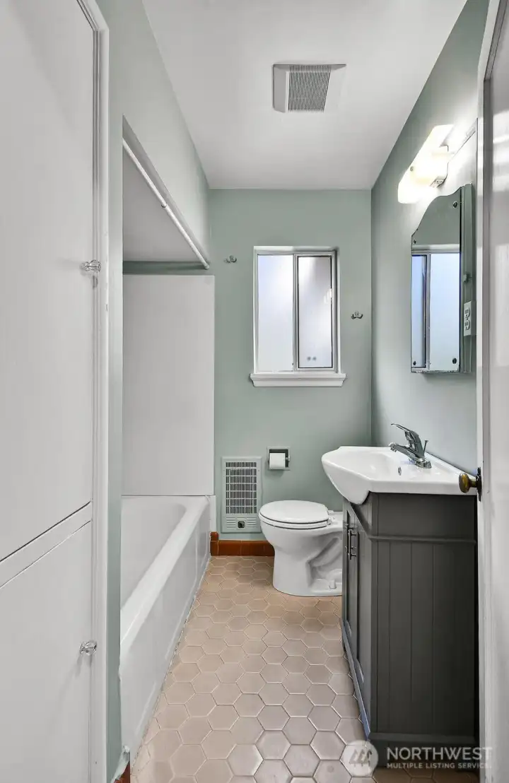 Bathroom with built-in storage.