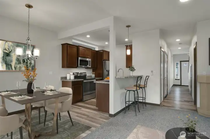 View capturing Dining Area, Kitchen & Eating Bar to the Entry-Virtually Staged