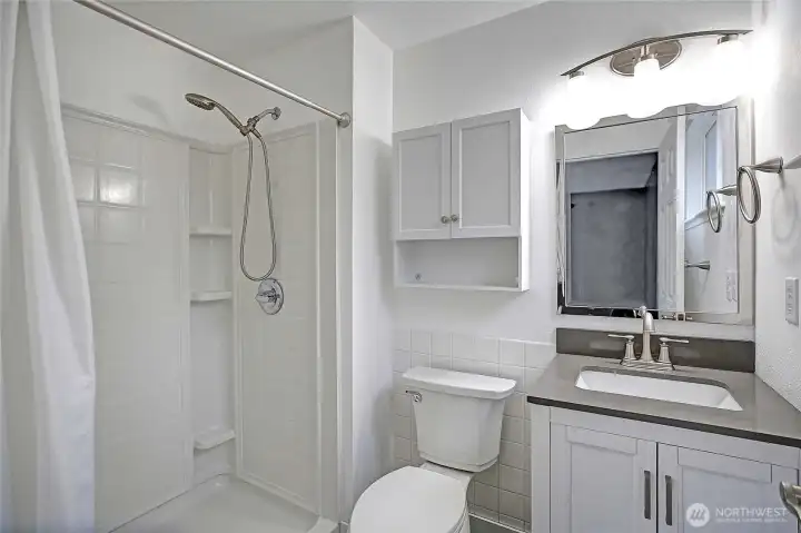 Primary attached bathroom with shower.