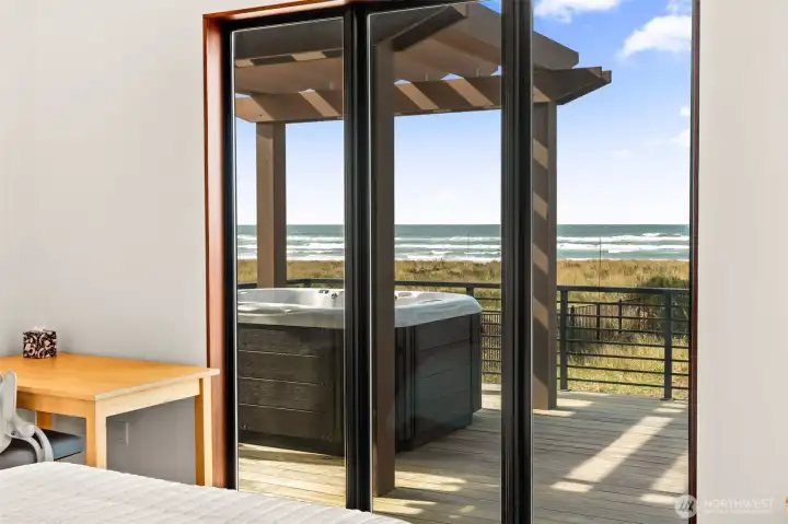 Coast Spa luxury acrylic hot tub under stylish pergola. West yard aluminum fencing